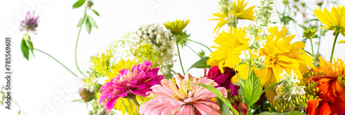 Summer bouquet of colorful Zinnia, onion inflorescences and mint sprigs, Rudbeckia Goldquelle and red clover, Ranunculus and Matricaria, home decoration with flowers banner photo