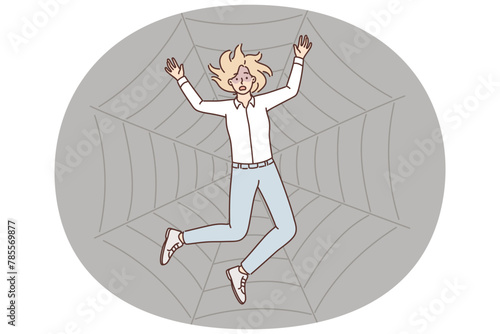 Stressed woman trapped in spider web