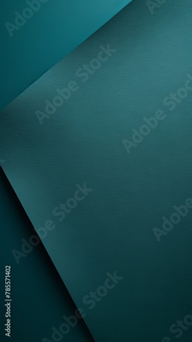 Teal background with dark teal paper on the right side  minimalistic background  copy space concept  top view