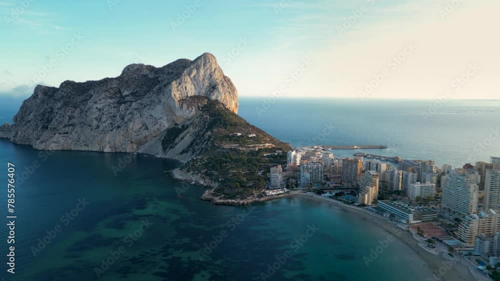 Cinematic aerial view of Calp city. Drone slowly track right above the ...