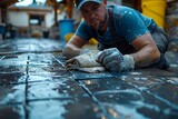 An image capturing the painstaking work of a worker cleaning pavement tiles, reflecting the diligence and labor in urban maintenance