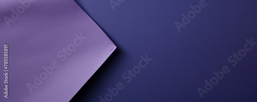 Violet background with dark violet paper on the right side, minimalistic background, copy space concept