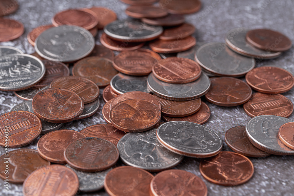 American coins and US dollars on a wooden table American coins and US dollars on a wooden table