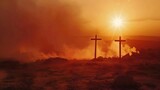 Three weathered crosses silhouetted against fiery sunset on barren hilltop.