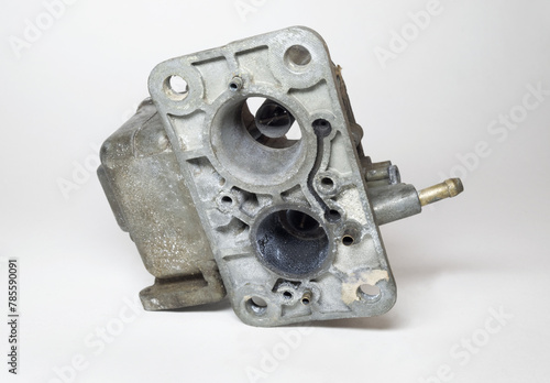 float bowl of dual barrel carburetor, showing lower side. two air intake horns with venturi narrows