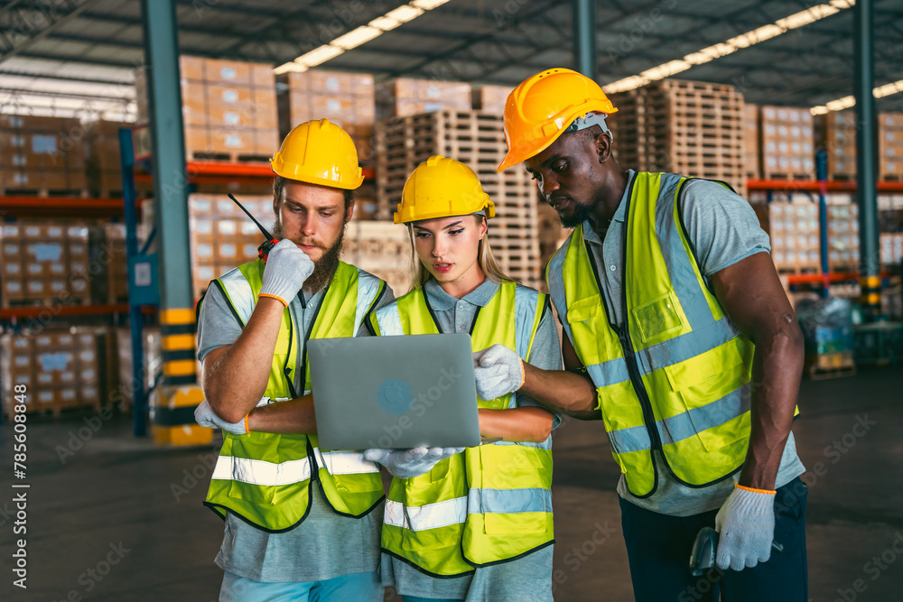 In a factory setting, a team of engineers and foremen emphasize safety and teamwork during a meeting, ensuring success in the construction industry. In a factory setting, a team of engineers and foremen emphasize safety and teamwork during a meeting, ensuring success in the construction industry.