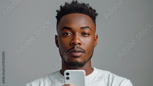 Man Holding Cell Phone in Front of Face