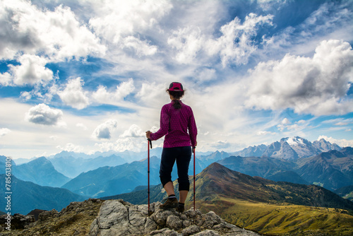 Hiker on the mountain top. Sport and active life concept. Amazing view of Dolomites Alps, Italy, Europe. Travel in nature. Artistic picture. Beauty world.