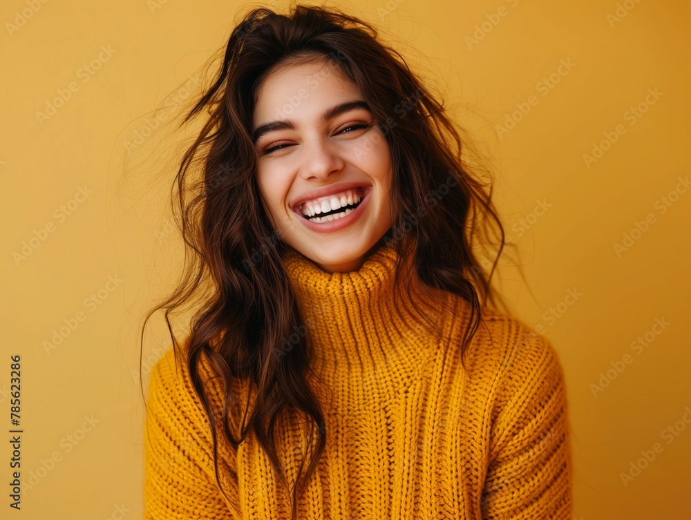 Portrait of happy young woman smiling at camera isolated on bright yellow background Portrait of happy young woman smiling at camera isolated on bright yellow background