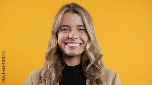 Friendly student woman showing yes signal, approve. Smiling happy business lady photo