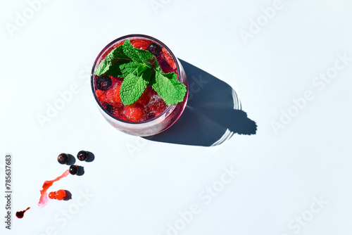 Berry refreshing cold summer drink. Cocktail or mocktail with ripe seasonal berries and mint. Detox drink. Fruit iced thirst quenching drink.