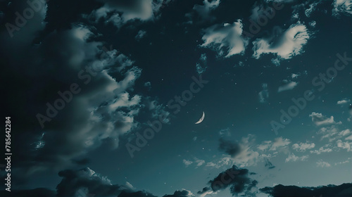 Moon in a cloudy night sky 