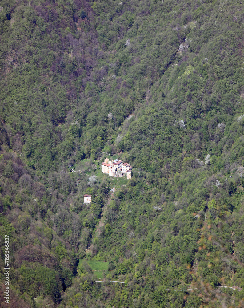 few houses in the remote district in the middle of the woods on the slopes of the mountain