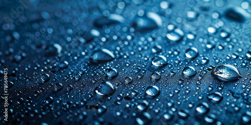 Close-up of Water Droplets on a Dark Shiny Surface - Texture Background