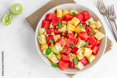 Refreshing and Healthy Watermelon and Pineapple Salad Garnished with Mint Leaves Top Down Healthy Food Photography