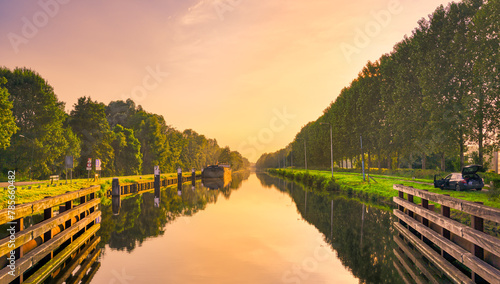 Sunset over the Wilhelminakanaal canal near the village of Beek en Donk, The Netherlands. photo