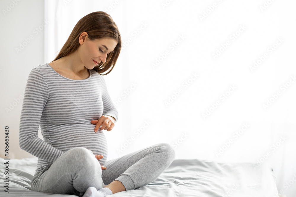 Pregnant woman enjoying a moment of calm at home