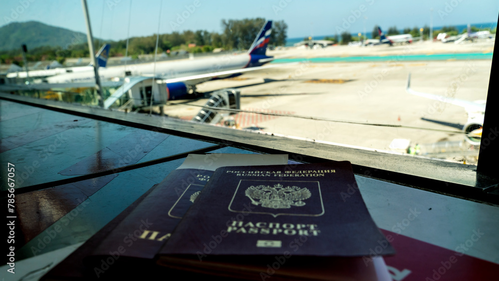 Naklejka premium Passport lies on a chair at the airport