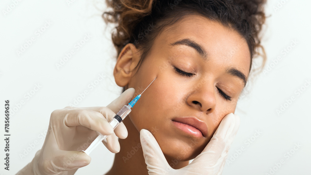 Beauty procedure. Woman receiving hyaluronic acid injection Beauty procedure. Woman receiving hyaluronic acid injection