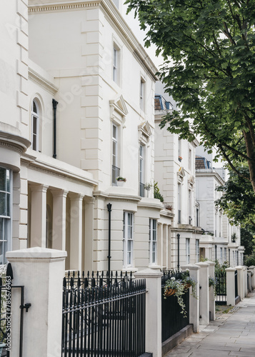 White terraced houses on a street in London, UK.