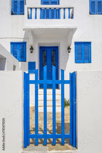 Greek whitewashed house with blue gate in Nikia village on Nisyros island. Greece © vivoo