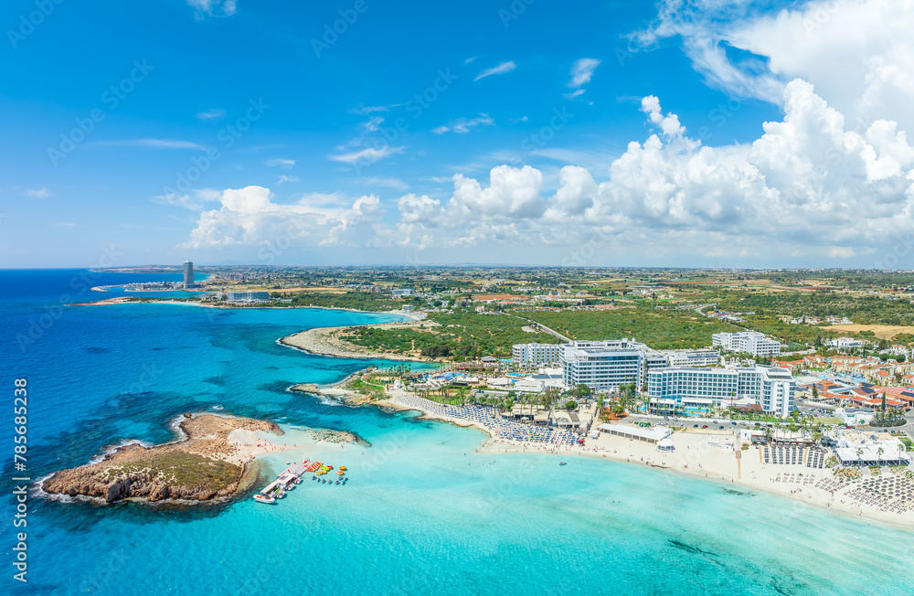Discover the pristine Nissi Beach in Cyprus, a paradise with white sands and turquoise waters, perfect for relaxation, water sports, and family holidays