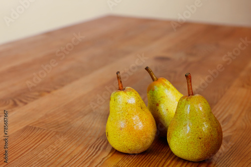 Yellow pears on table