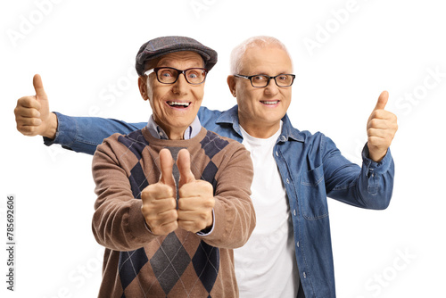 Elderly man and son showing both thumbs up