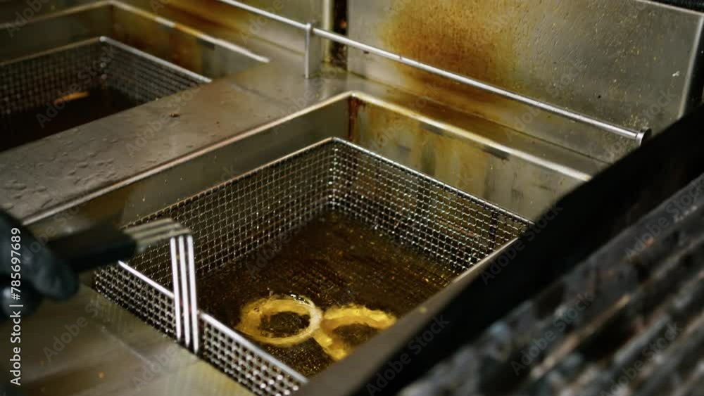 Frying The Onion Rings Inside A Pub Kitchen Frying The Onion Rings Inside A Pub Kitchen