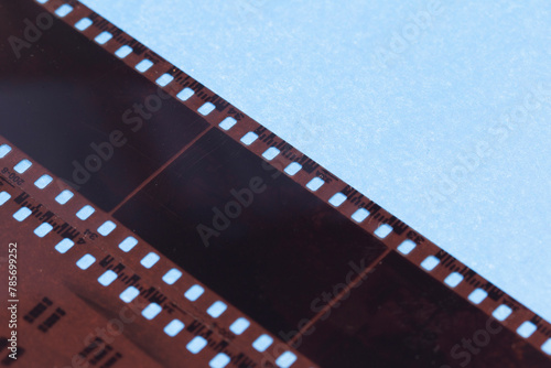 35mm positive filmstrips with empty frames, real scan of film material with cool scanning light interferences on the material. 