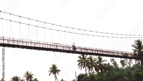 Person Walking on the Old Bridge In India