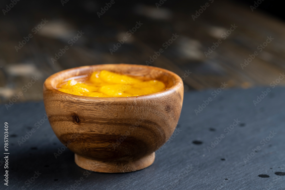 ripe small slices of tangerines in sweet syrup ripe small slices of tangerines in sweet syrup