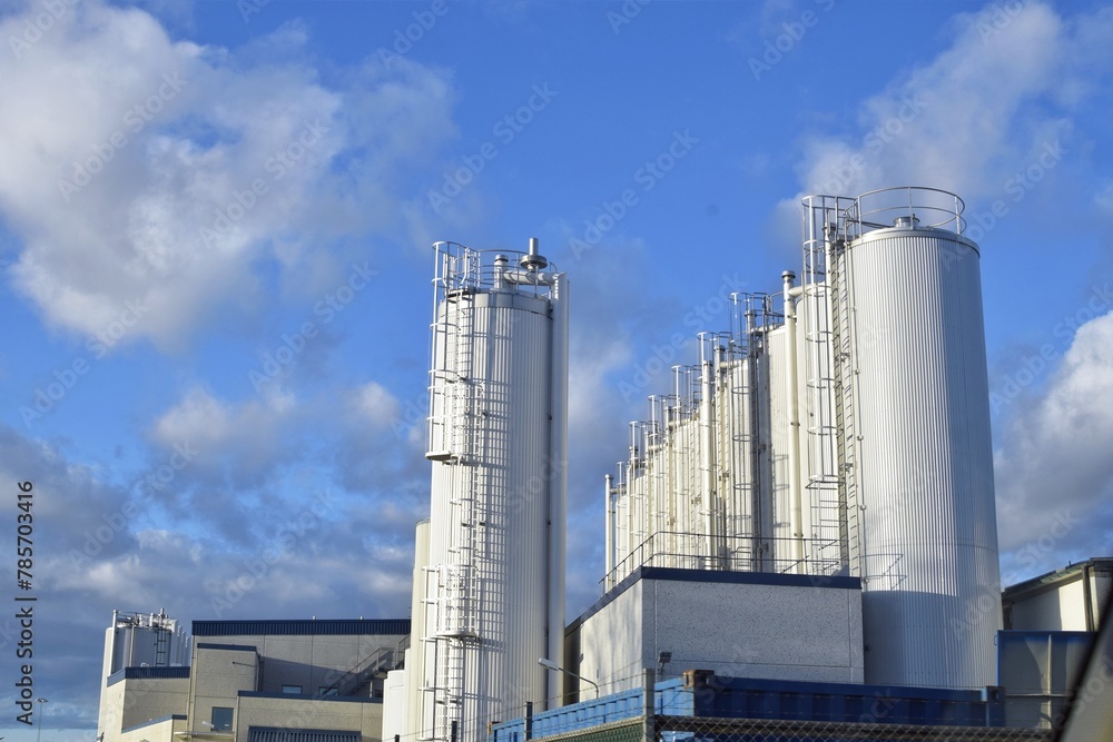 White tanks of a modern dairy plant.