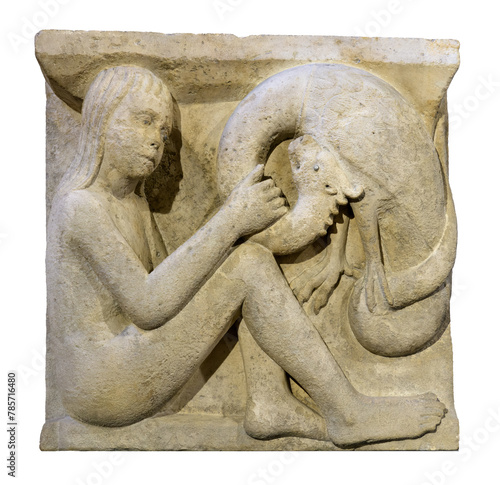 Boy with the young dragon. Metope of Modena Cathedral. photo