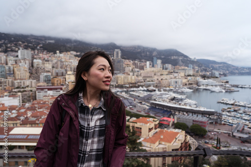 Young woman overlooking Monaco cityscape and harbor photo
