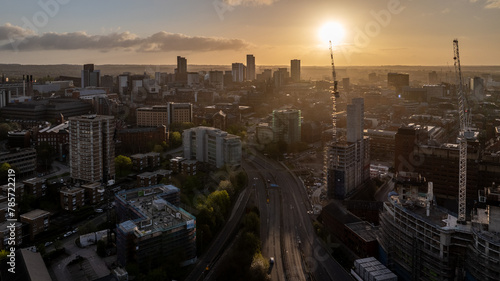 The vibrant sunrise creates a striking backdrop for Leeds' developing city centre and highlights the architectural prowess of West Yorkshire with drone imagery