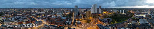 Early morning sunrise touches the Leeds, West Yorkshire cityscape, featuring the city centre and building construction, captured aerially by a drone photo