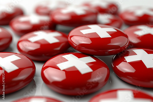 A close-up of numerous glossy buttons featuring the iconic Swiss cross, signifying solidarity and celebration for Swiss National Day photo