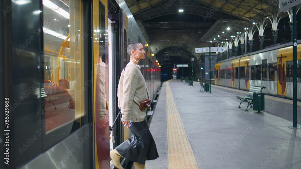 Woman leaving train wagon looking smartphone. Short hair businesswoman arrive Woman leaving train wagon looking smartphone. Short hair businesswoman arrive