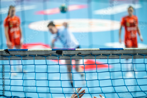 Detail of handball goal crossbar with net penalty shot in the background.