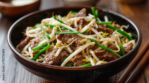 Savory beef stir fry with sprouts and scallions photo