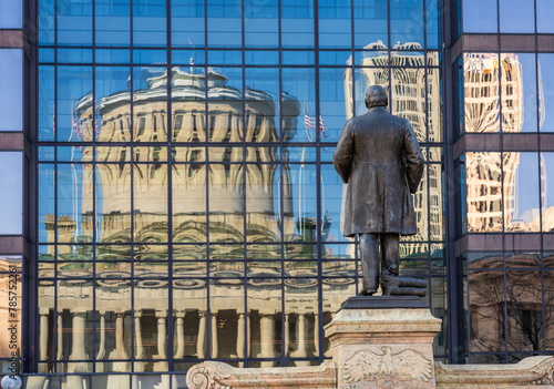 McKinley memorial in front of a reflection of the Ohio state Capitol building in the windows of an office building across the street in Columbus, OH