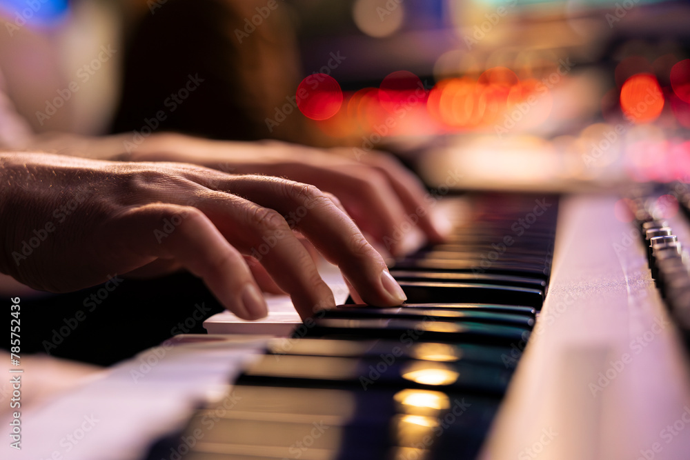 Musician playing electronic keyboard synthesizer in professional studio, creating songs and working with producer on new album. Talented singer composing music on electronic keyboard. Close up. - obrazy, fototapety, plakaty 