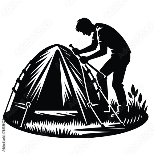 silhouette of a person setting up a tent at a campsite isolated