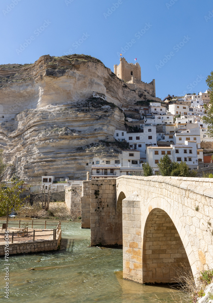 Alcalá del Júcar, is located on a rock formed by the gorge of the Júcar River, cave houses roman bridge, castle, Church of San Andrés Apóstol (Albacete, Spain).