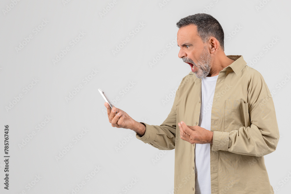 Senior man using smartphone on white background Senior man using smartphone on white background