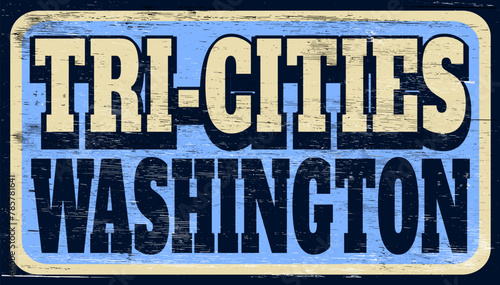 Aged and worn Tri-Cities Washington sign on wood