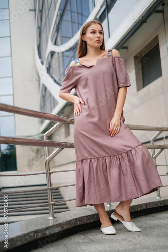 woman in colorful dress posing outdoors