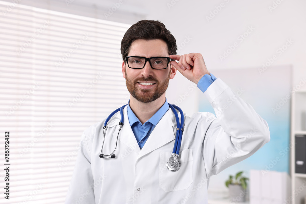 Medical consultant with glasses and stethoscope in clinic Medical consultant with glasses and stethoscope in clinic