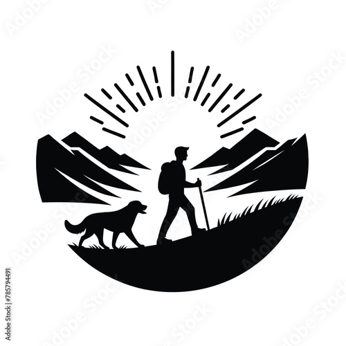 silhouette of hiker and their dog hiking together on a mountain trail